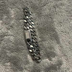 Unisex Bulova SS bracelet with Diamond clasp.